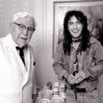 Alice Cooper meets Colonel Harland Sanders of Kentucky Fried Chicken in Amsterdam while they were both at the same hotel in 1974.