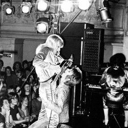 David Bowie and Mick Ronson, 1972 “Guitar Fellatio” photographed by Mick Rock