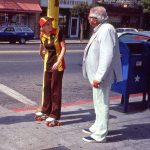 “Rollerskating Burger King employee chats with Col. Sanders. California, late 70s”