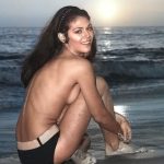 Pamela Hensley topless on the beach