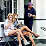 Two women stop at a pub to have a pint of beer sitting outside the Fox and Pheasant while shopping in Billing Street Chelsea SW10, near Chelsea football club – 1975