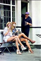 Two women stop at a pub to have a pint of beer sitting outside the Fox and Pheasant while shopping in Billing Street Chelsea SW10, near Chelsea football club – 1975