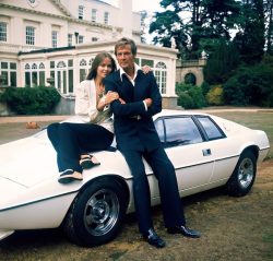Roger Moore, Barbara Bach and ‘Wet Nellie’ in the garden at Pinewood Studios.