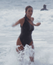 Lynda Carter running out of the water