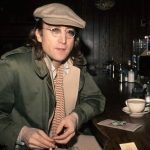 John Lennon sitting at a café in Yonkers, New York, 1975. Photo by Bob Gruen.