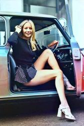 British model Jenny Clare posing in her Mini. London, 1972.